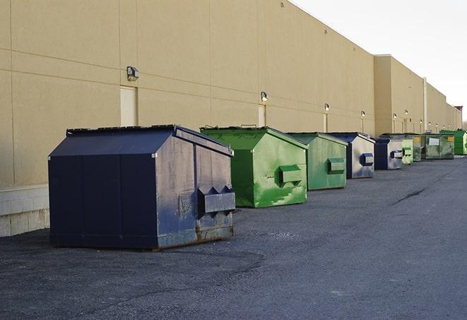 construction waste bins waiting to be picked up by a waste management company in Alhambra